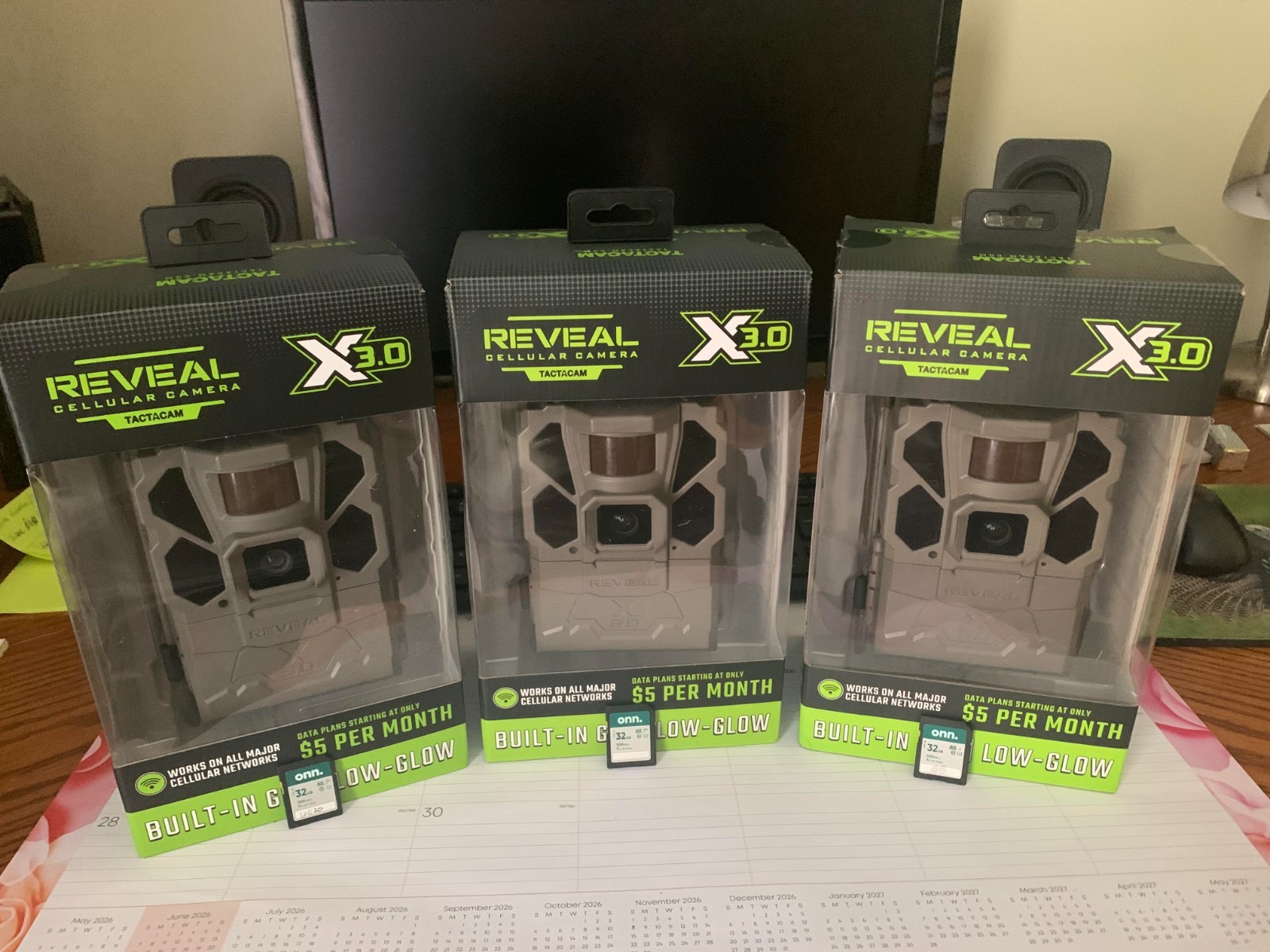 TACTACAM REVEAL TRAIL CAMERAS with tree mounts and 32GB SD cards.