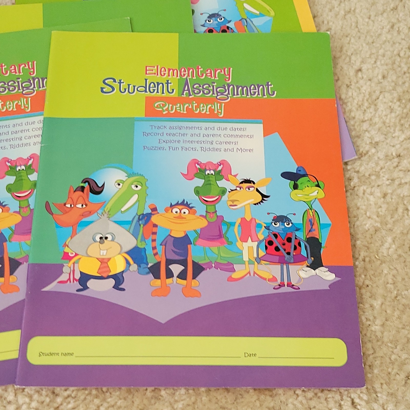 Five AES PHEAA Quarterly Assignment books, One My Student Planner Elementary