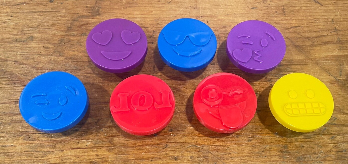 Seven emoji play doh presses