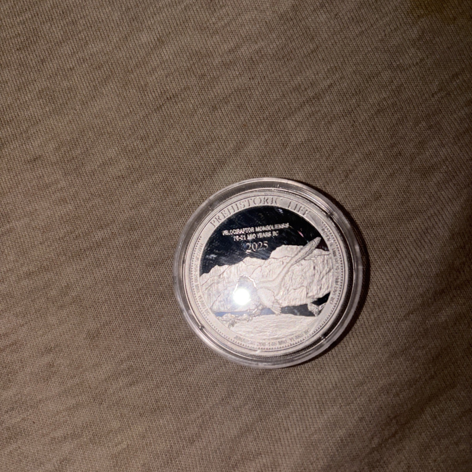 2025 Congo Prehistoric Life Velociraptor Mongoliensis 1 oz Silver BU coin in cap