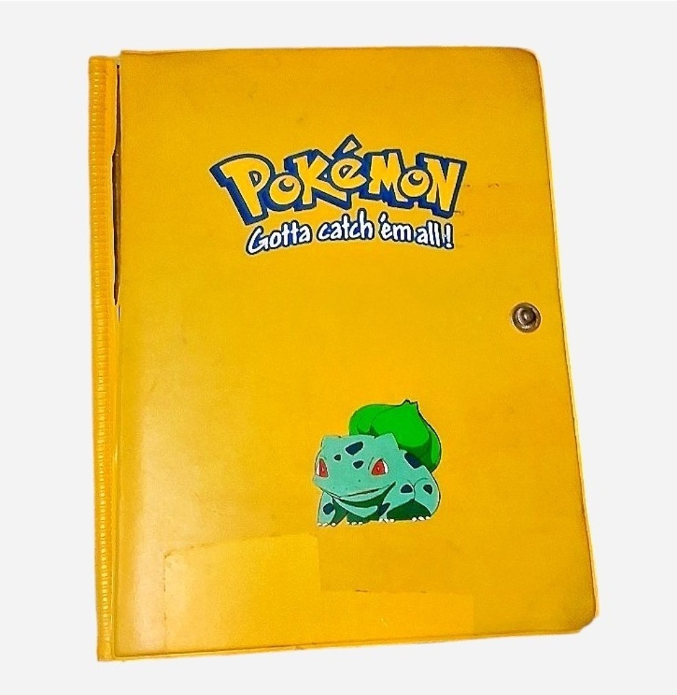 vintage Yellow Pokémon trading card binder with clear pockets for 1990s