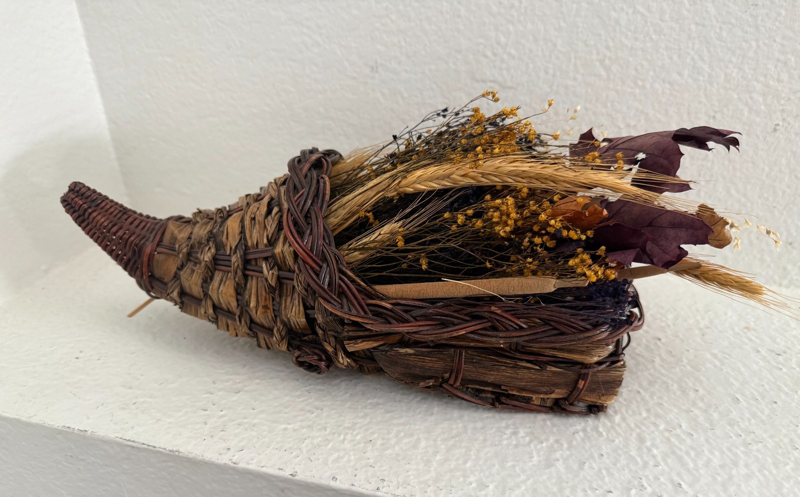 Woven Cornuccopia Basket Filled with Dried Harvest Botanicals