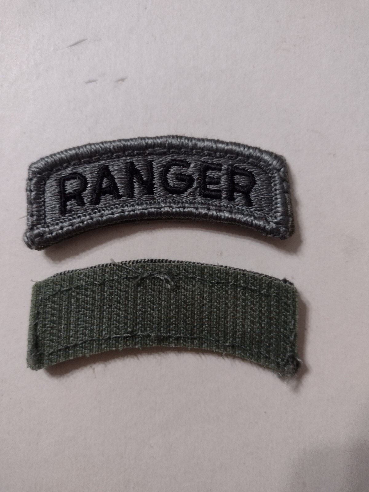 ARMY RANGER TAB - ACU COLOR (BLACK ON GRAY) WITH HOOK & LOOP ON BACK NOS