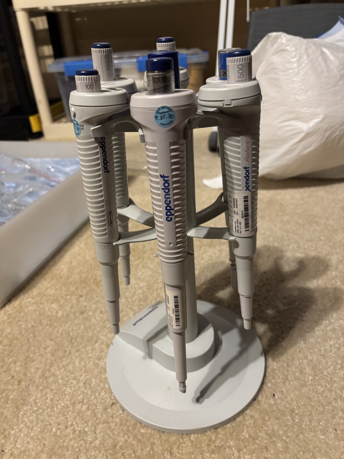 six used eppendorf micropipettes: 100, 200, 500, and 3 x 1000 microL
