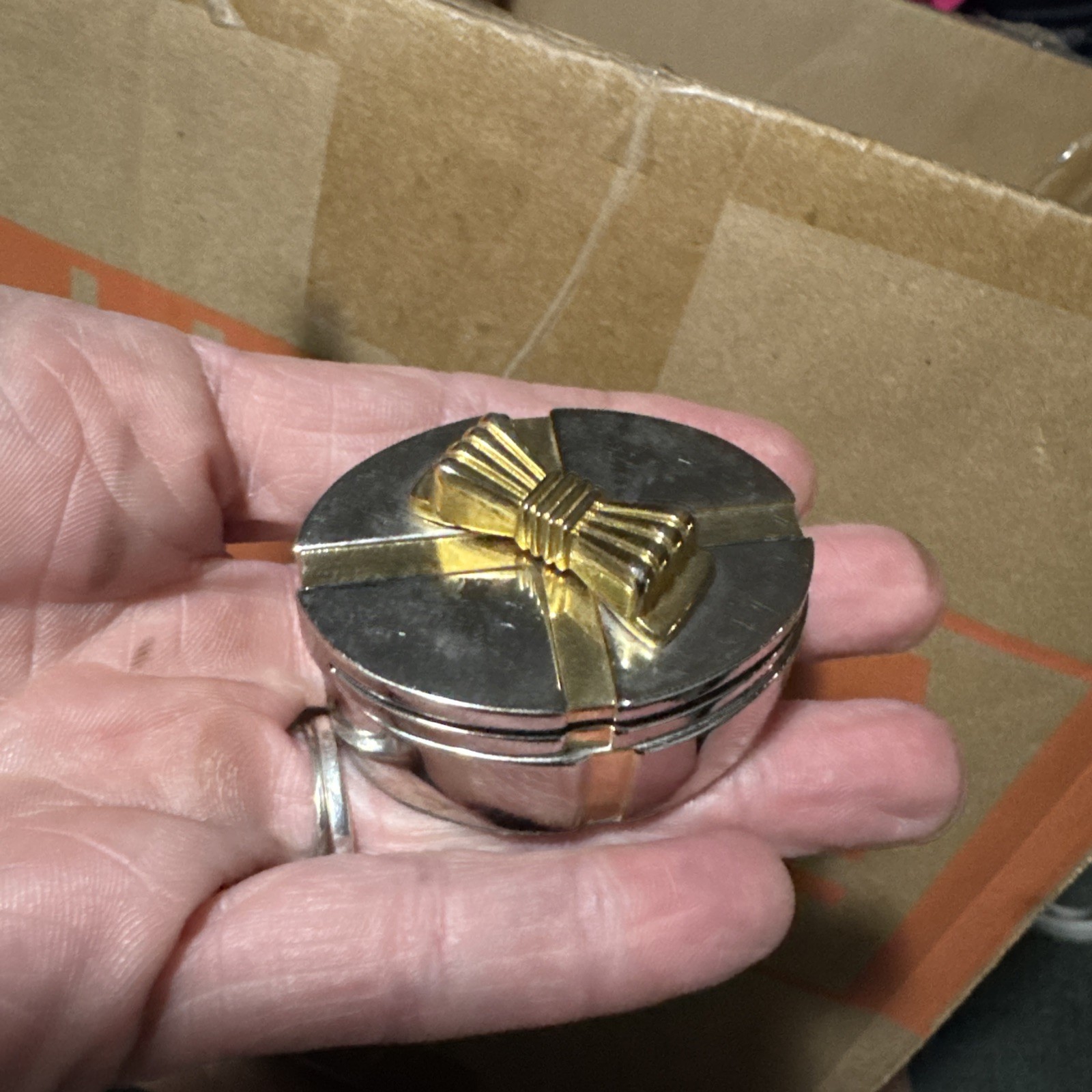 Oval Metal Box With Bow With A  Clock Inside