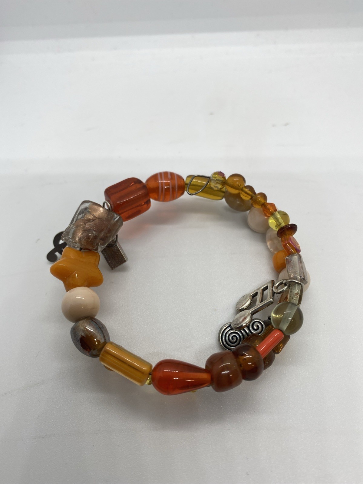 Handmade Orange Beaded Spiral Bracelet With Musical Charms