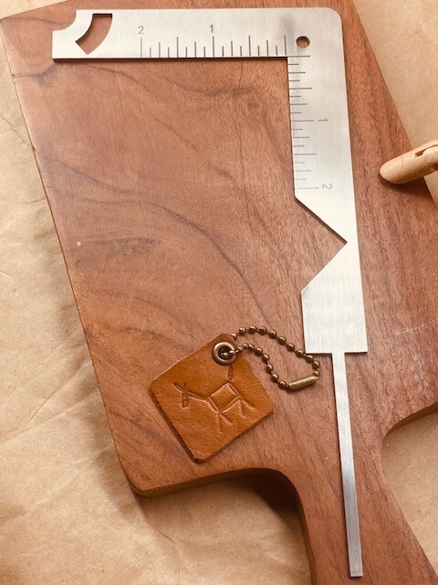 Bookbinding tool in heavy metal gauge (5-in-1).