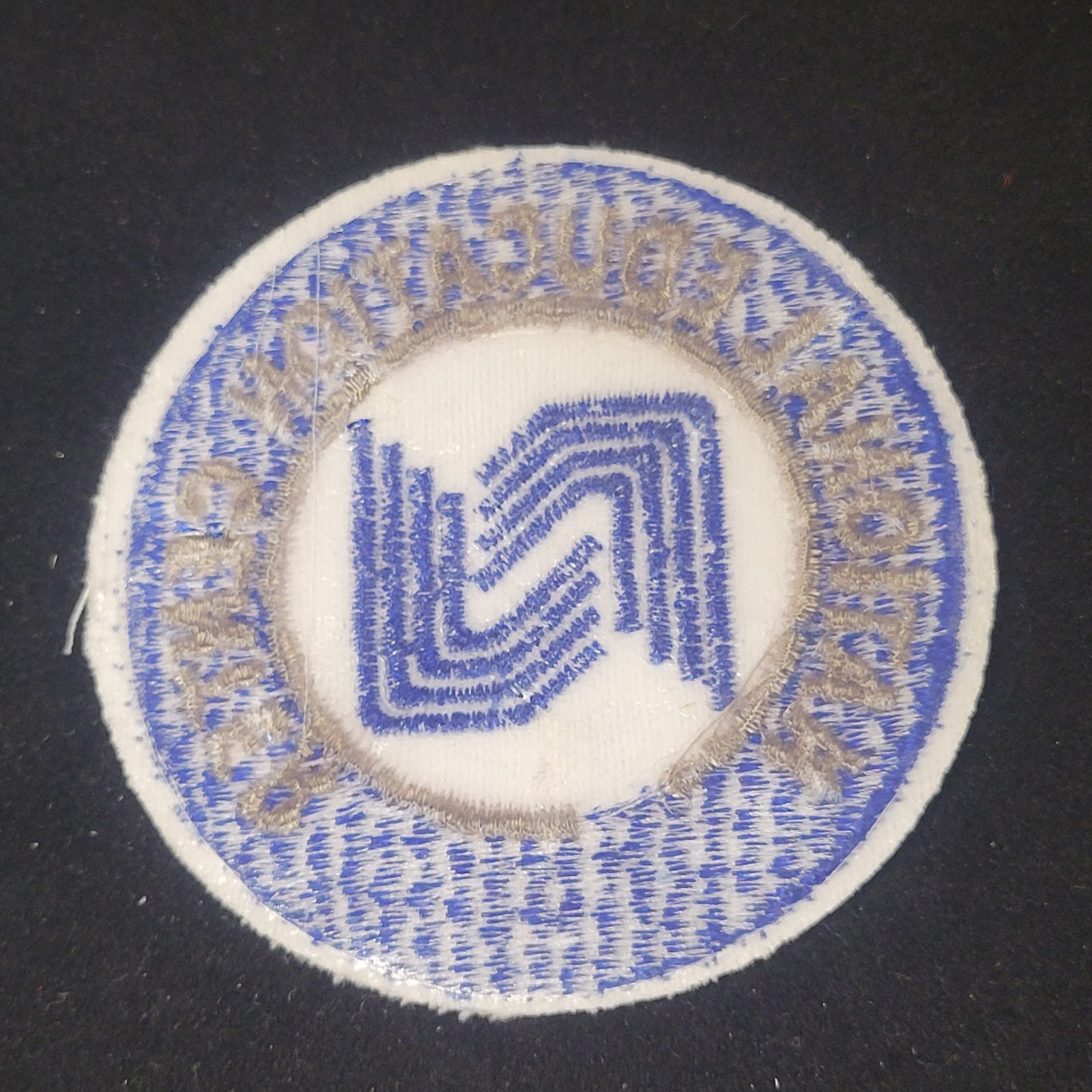 National Education Center Embroidered blue white silver patch