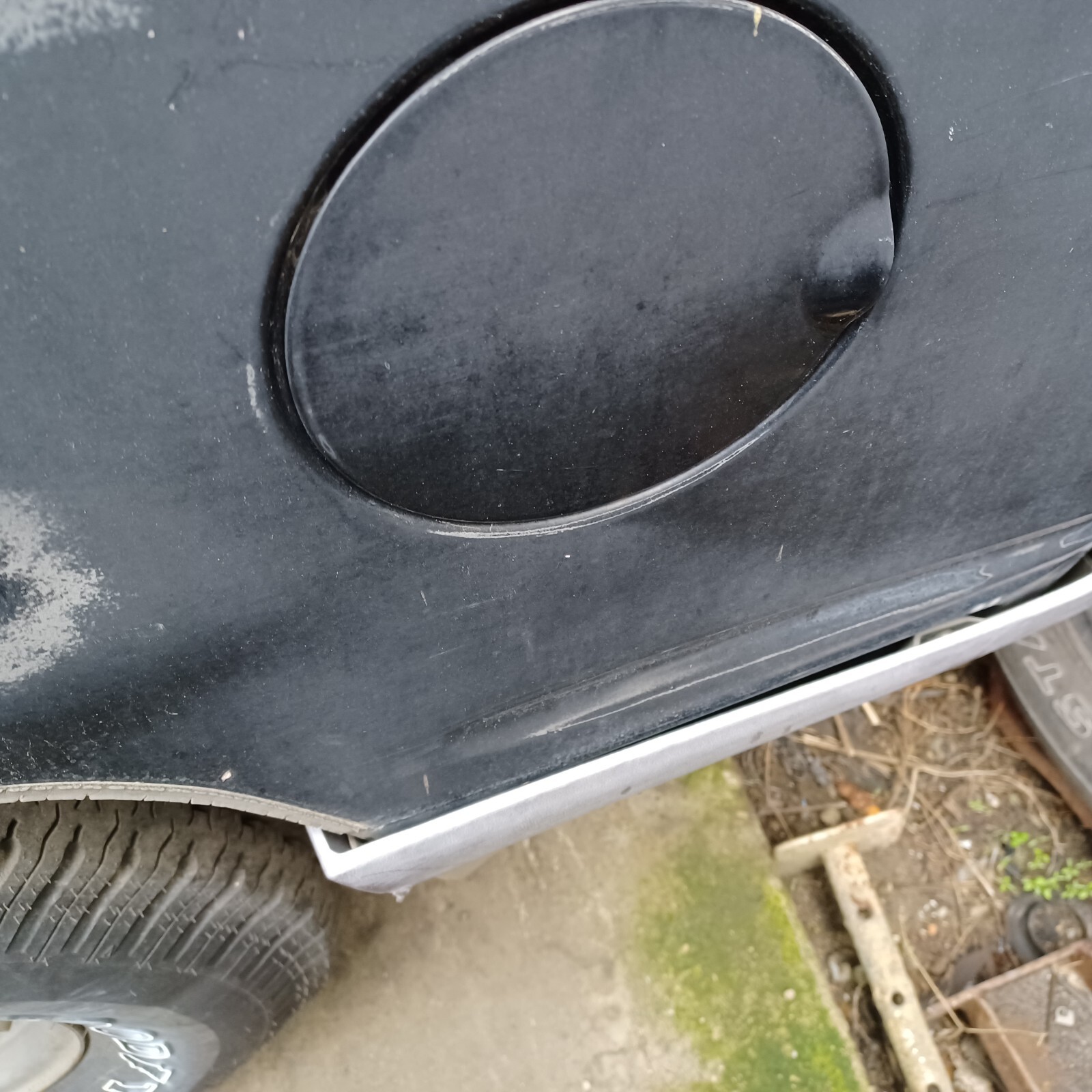 96 Explorer 4 door fuel door USED faded black