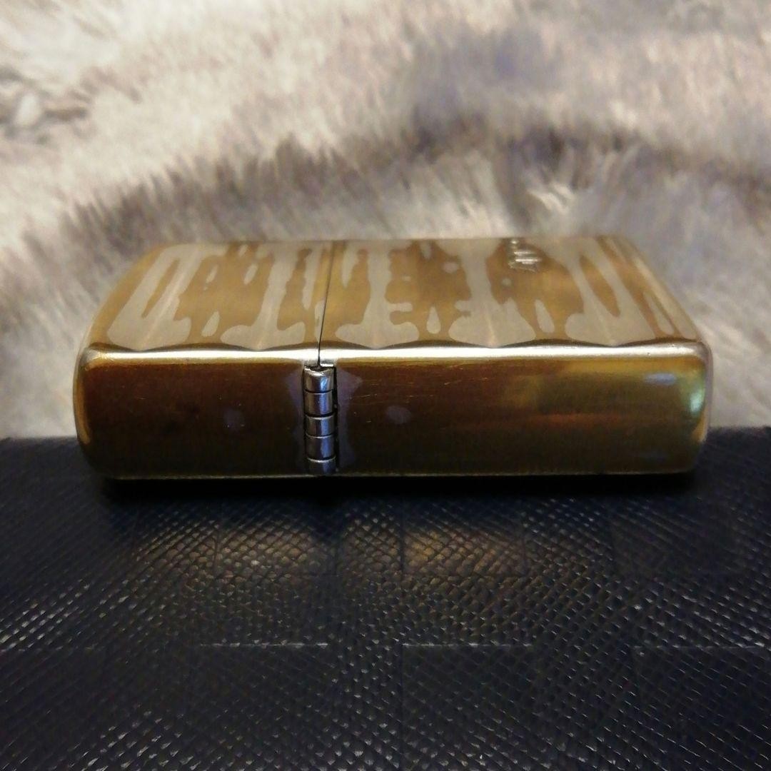Zippo lighter, double-sided design, made in 2002.