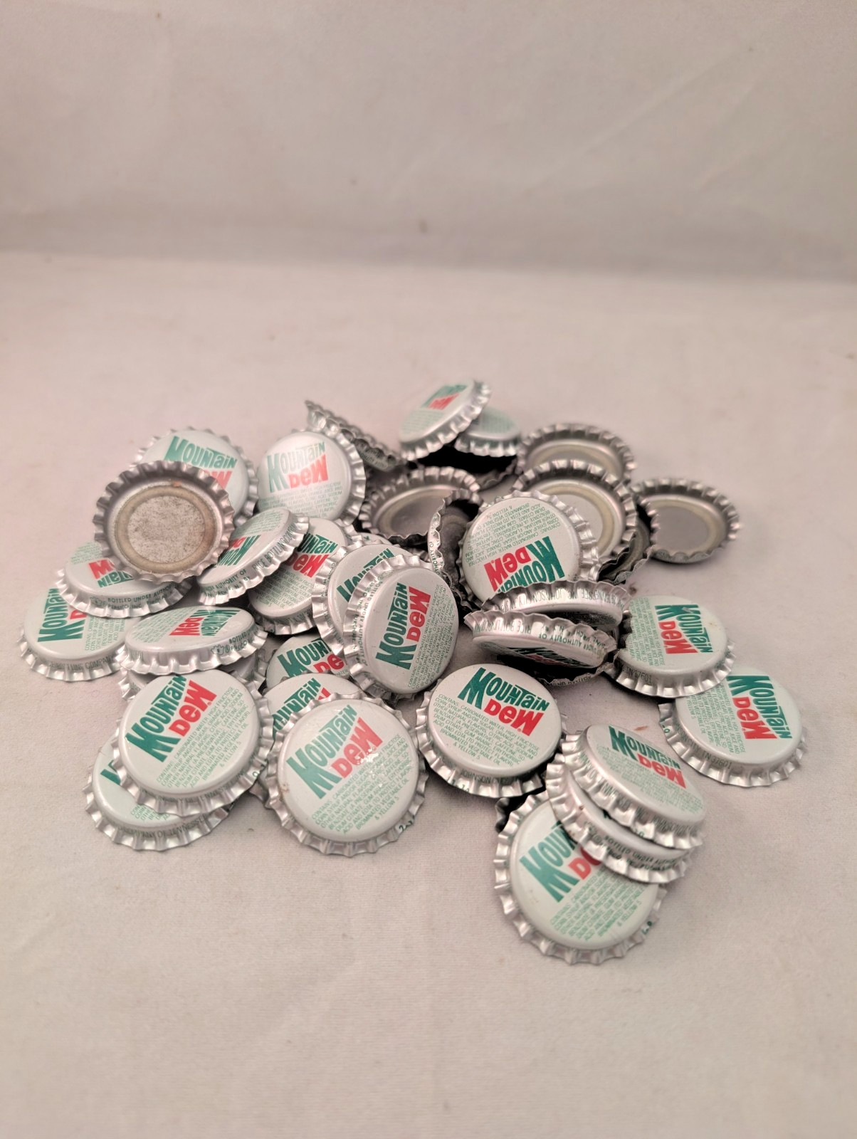 NOS Lot of 50 Mountain Dew bottle caps plastic lined Johnson City TN Tenn unused