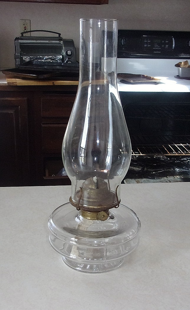 ANTIQUE OIL LAMP CLEAR GLASS W. BURNER, WICK, &  CHEMNEY MEASURES 14 INCHES " H.
