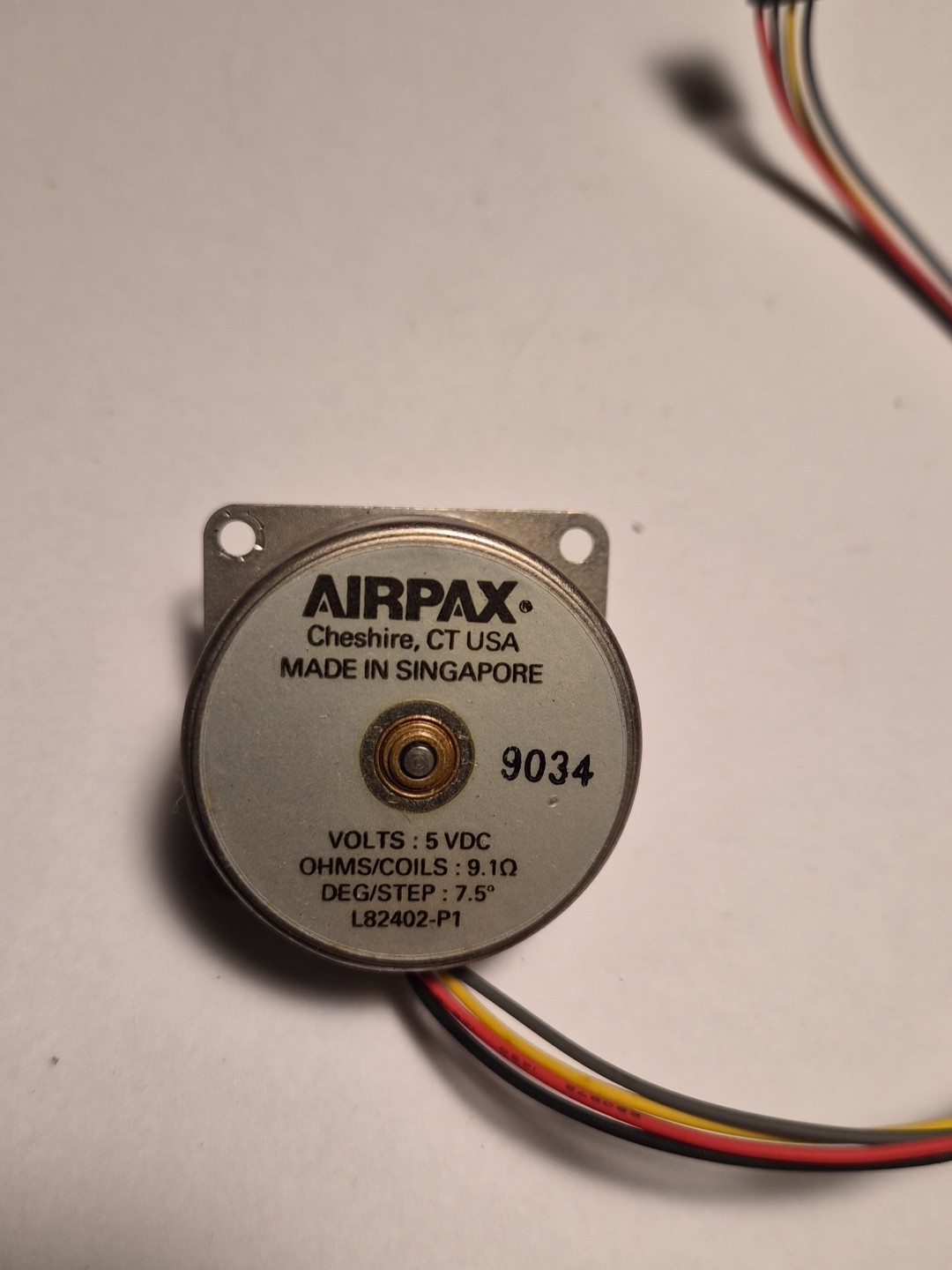 Airpax 5VDC Motor PN L82402-P1, Ohms/Coil: 9.1, Deg/Step: 7.5, Used.