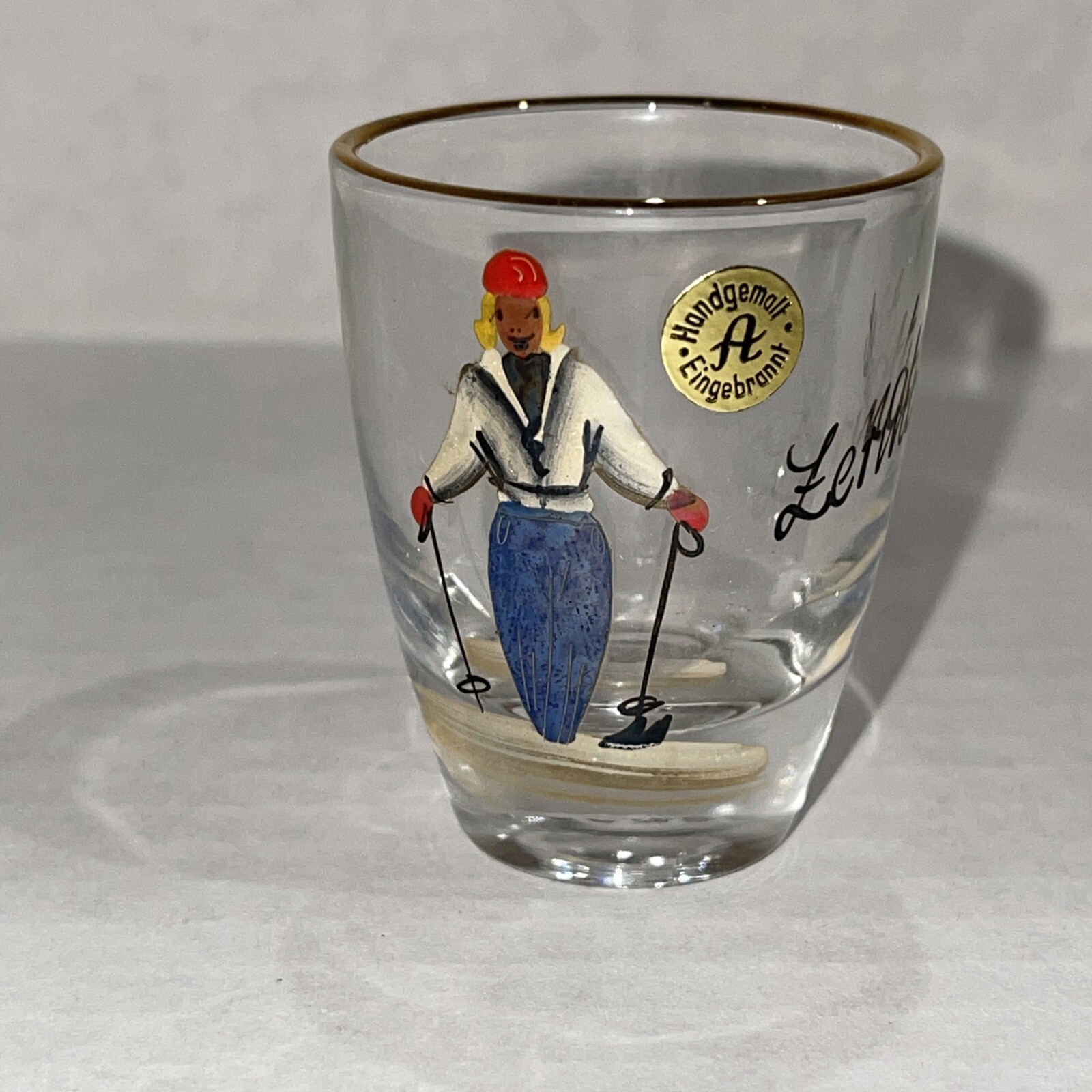 Handgemalt Enigebrannt Skier Hand Painted Souvenir Shot Glass,  Gold Trim