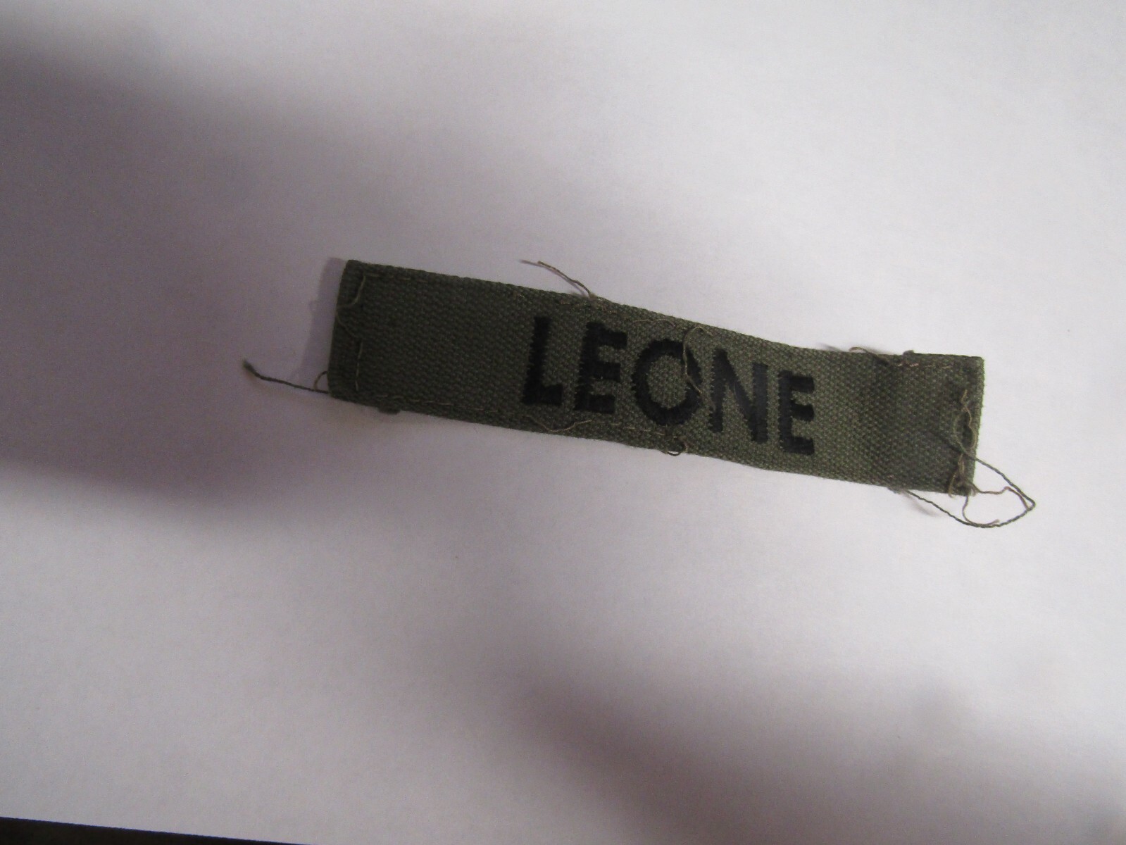 MILITARY PATCH OLDER COMBAT USED NAME TAPE VIETNAM ERA WITH NAME LEONE