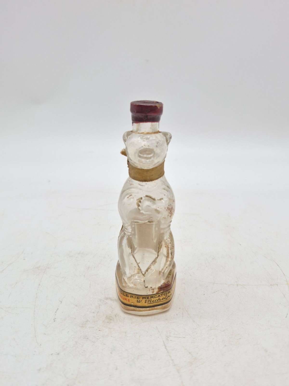 Antique bear figural liquor bottle original seal ribbon label Distillerie Mercat