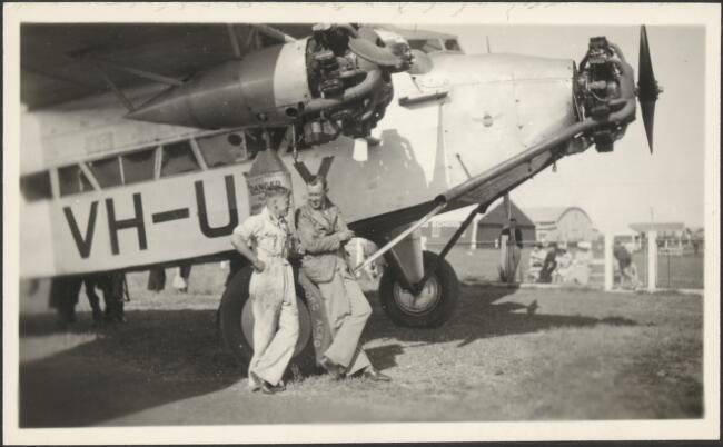 Leaning on wheel of Avro 618 Ten tri-motor monoplane VH-UXX AVIATION OLD PHOTO