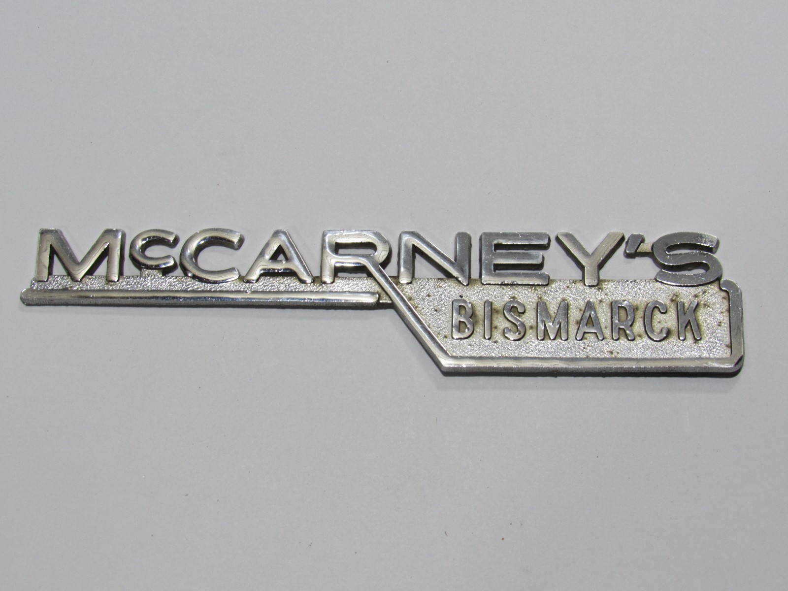 VTG McCarney's Ford Bismarck North Dakota Metal Dealership Badge Emblem Tag ND
