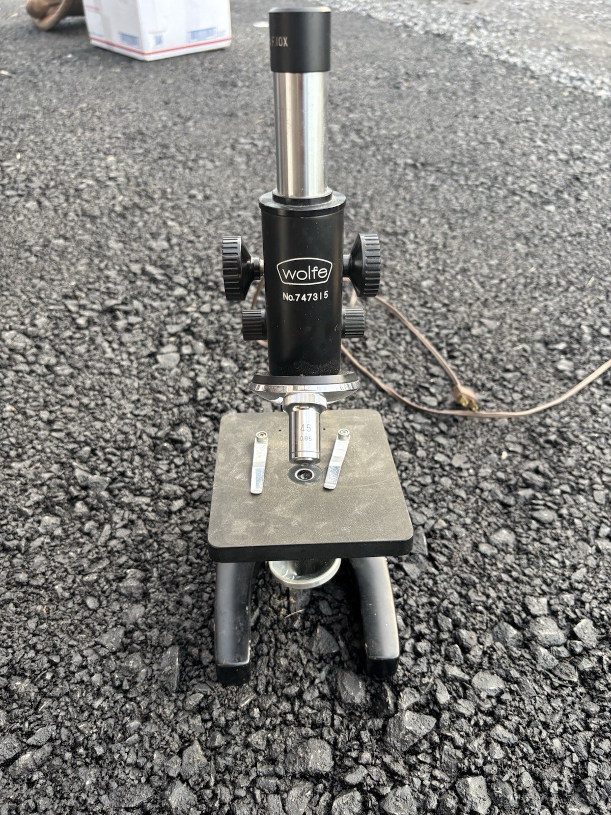 This is a vintage Wolfe student microscope likely imported from Japan,