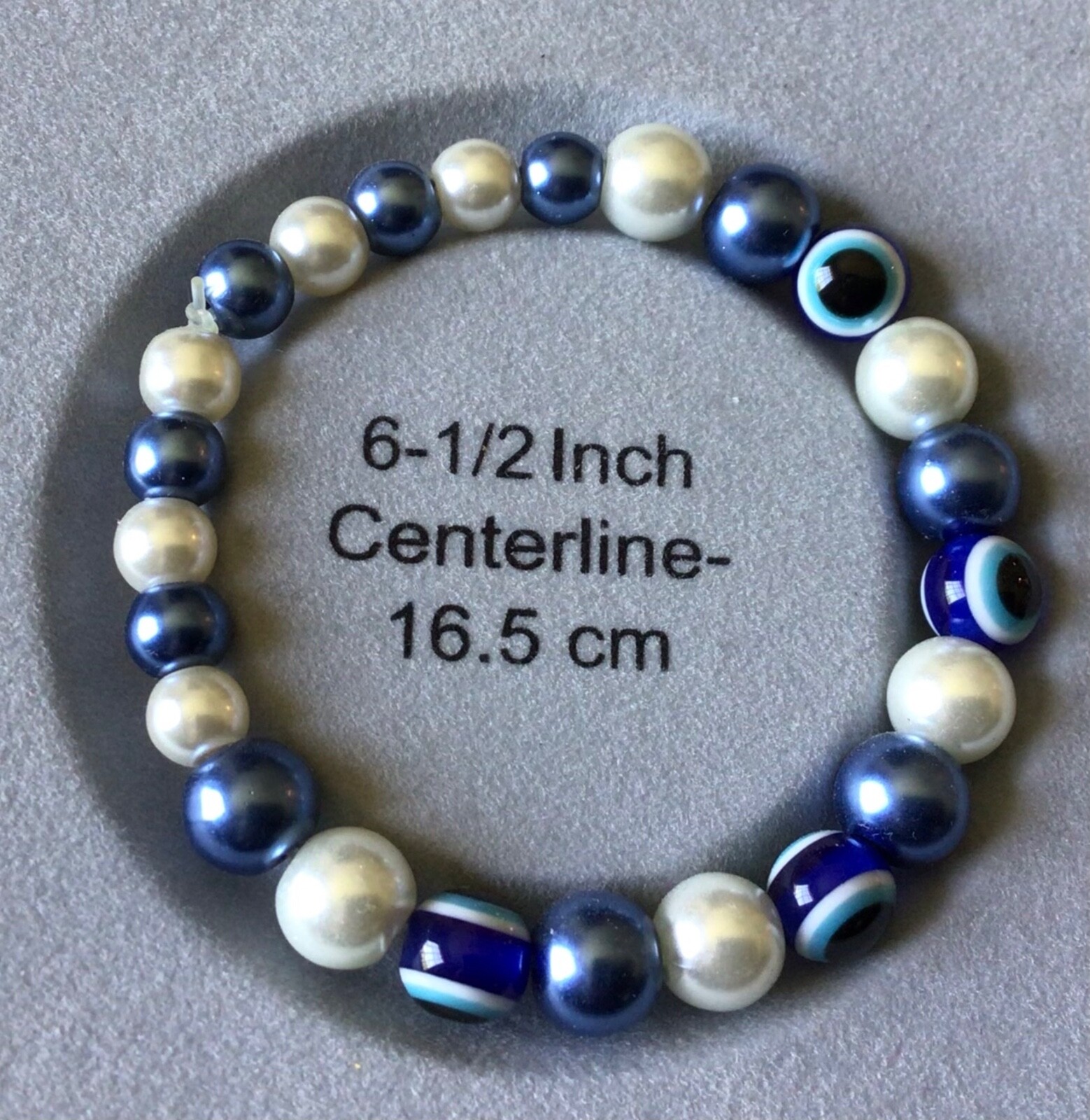 6.5” beaded bracelet w/blue, white and cats eye acrylic beads, Made in the USA