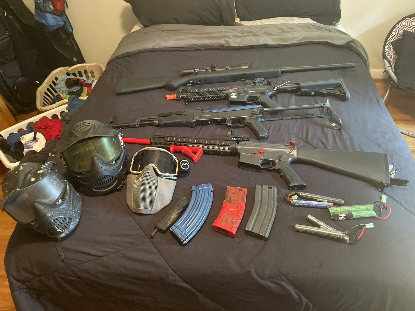 assorted air soft rifles and gear