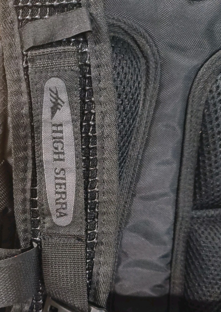 High Sierra lightweight hiking hydration pack customized with a blue Optum Logo