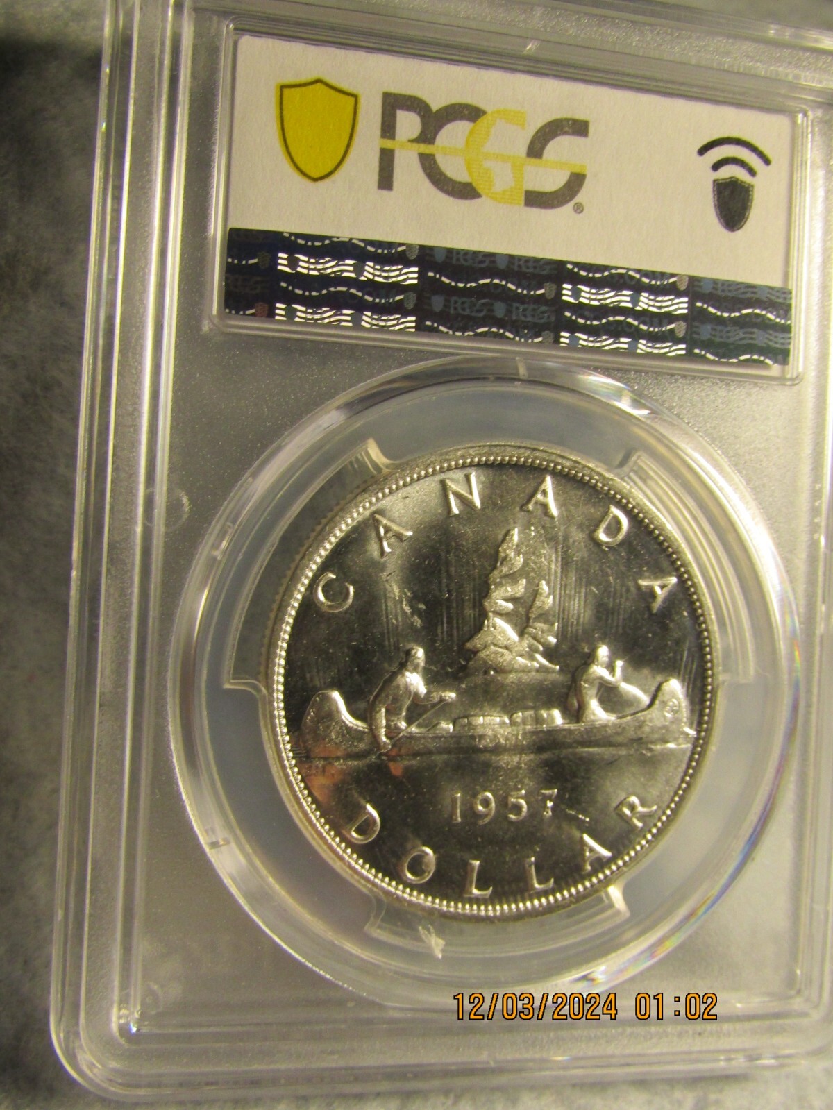 1957 CANADA SILVER $1 DOLLAR...PCGS MS-63..GOLD SHIELD