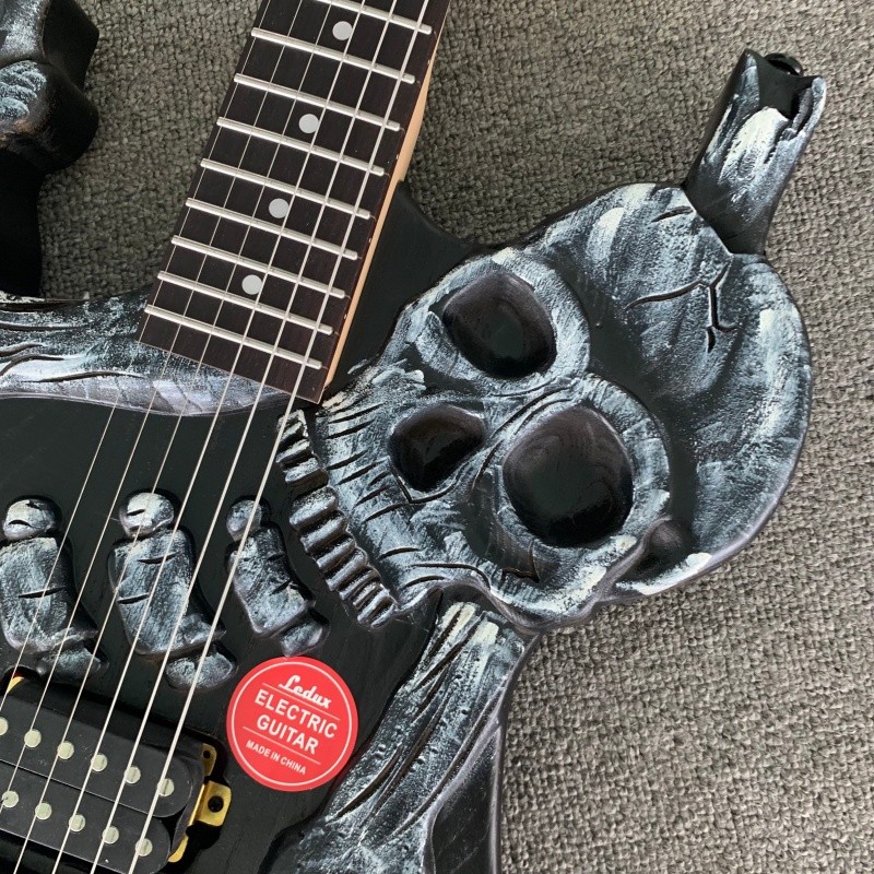 Left Hand Skull Solid Electric Guitar Rounded Fret Edge Maple Neck Hard Rock
