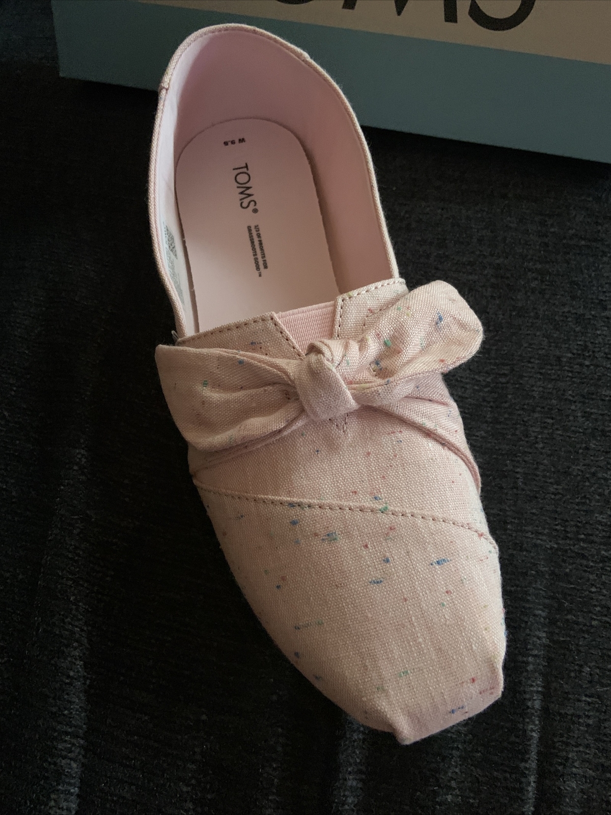 toms ladies chalky pink speckled lined/bow slip on size 9.5