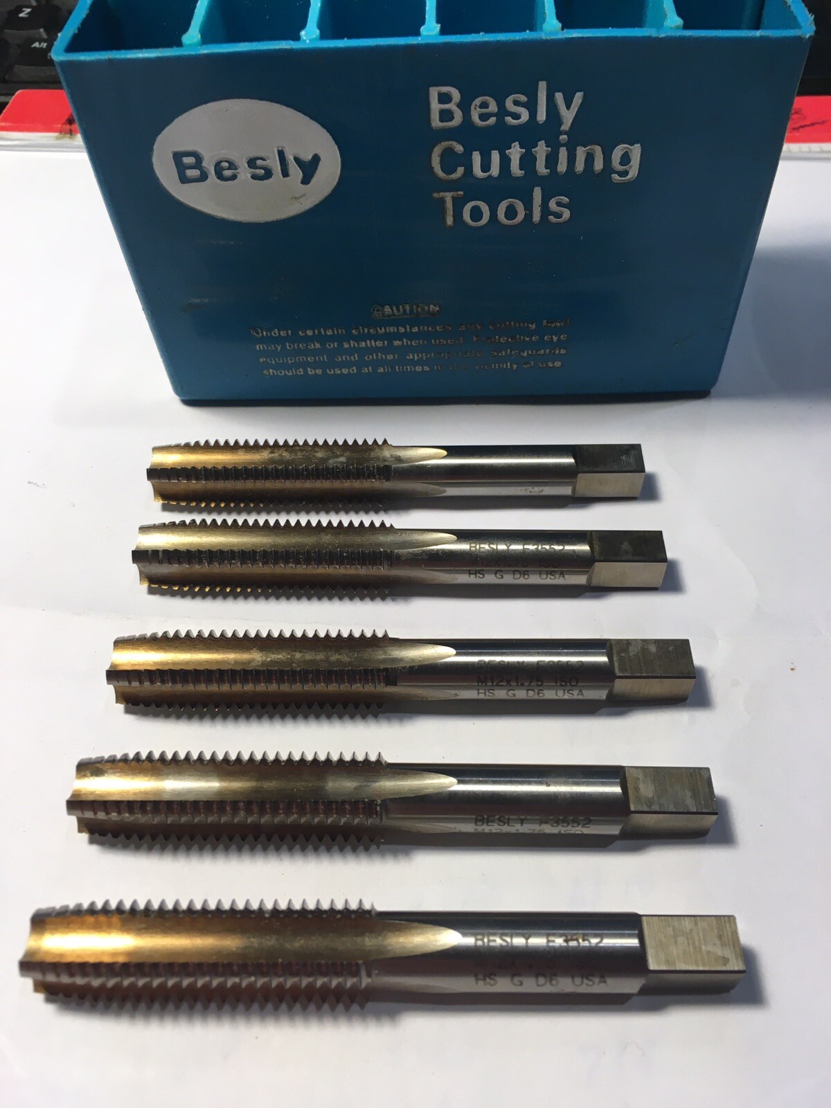 Five Besly F3552 12 x 1.75 HSG D6 4-flute Taps (used?)