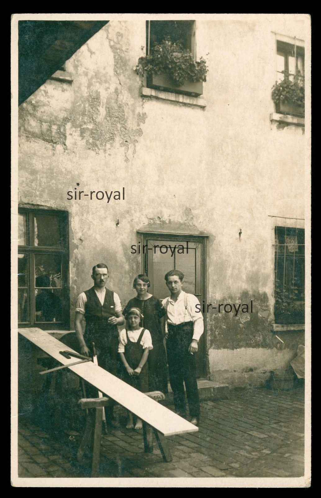 Man with family in front of his workshop - 1930s - profession - photo postcard 9x14cm