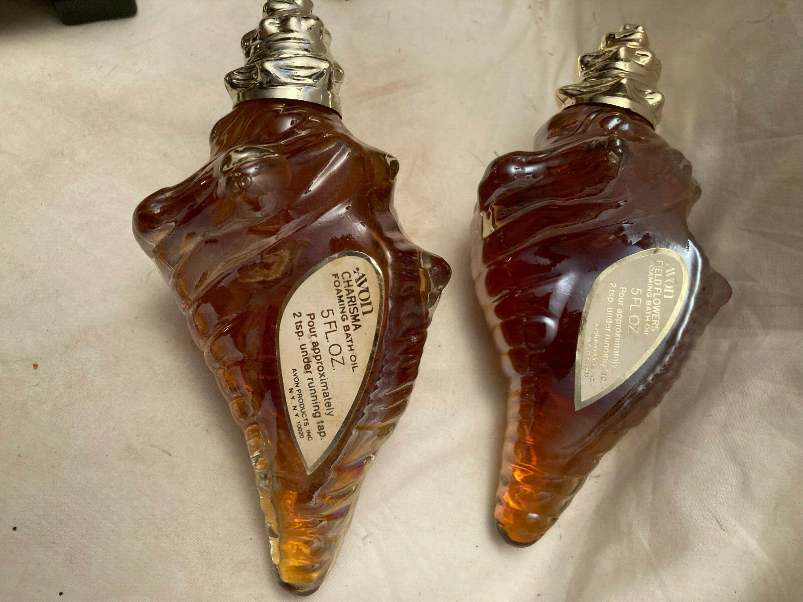 AVON  2 BOTTLES OF "CHARISMA" BATH OIL AND  "FIELD  FLOWERS " B OIL 5 FL OZ EACH