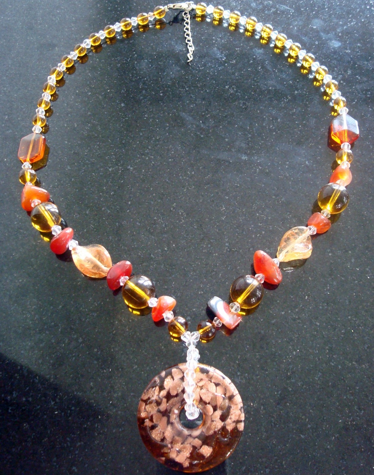Lampwork glass focal donut with amber glass, copper swirls 22 inch glass fj015