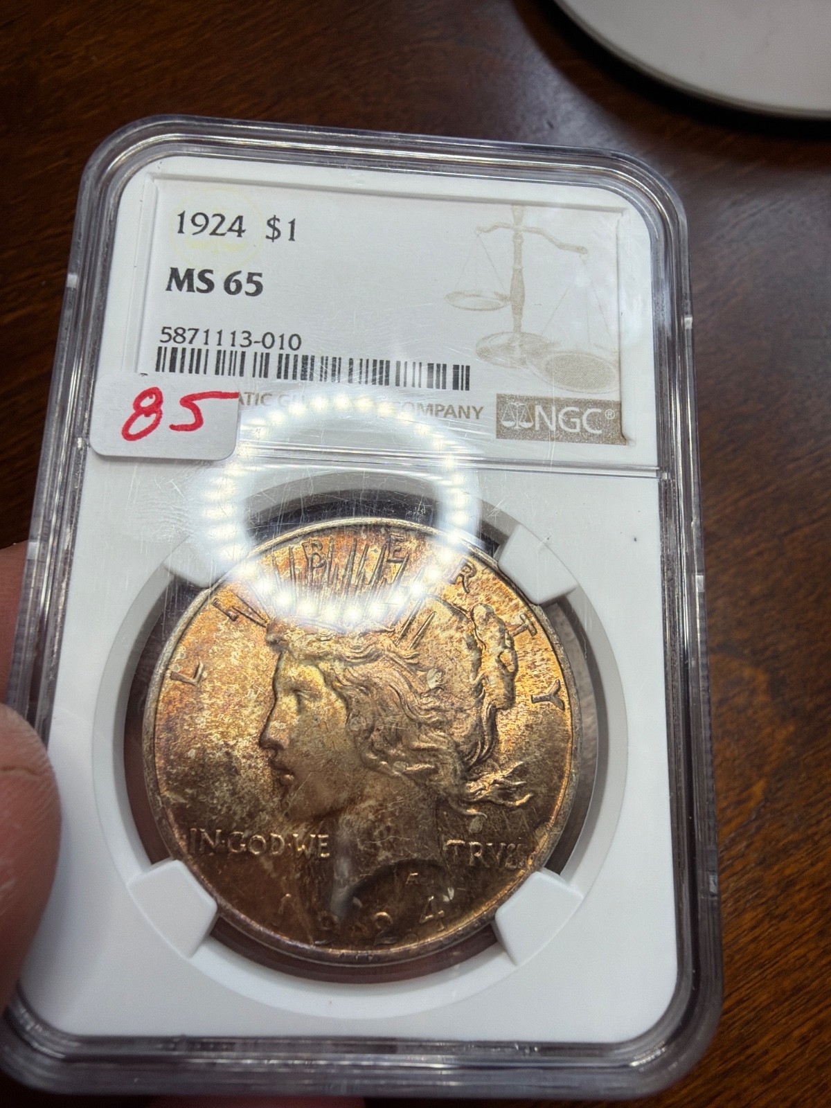 Golden Brown Toned High Grade 1924 Peace Dollar. NGC MS65. Item No 85