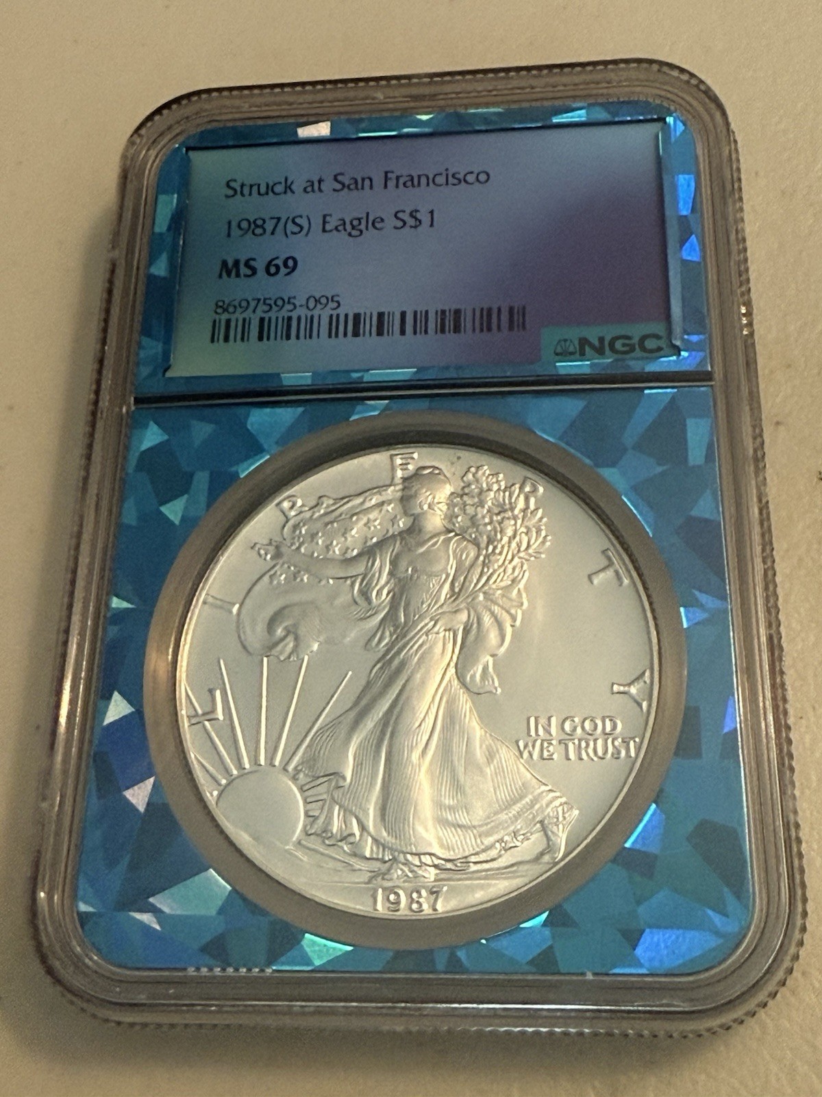 1987 (S) Eagle S$1 MS 69 NGC Blue Prism Slab
