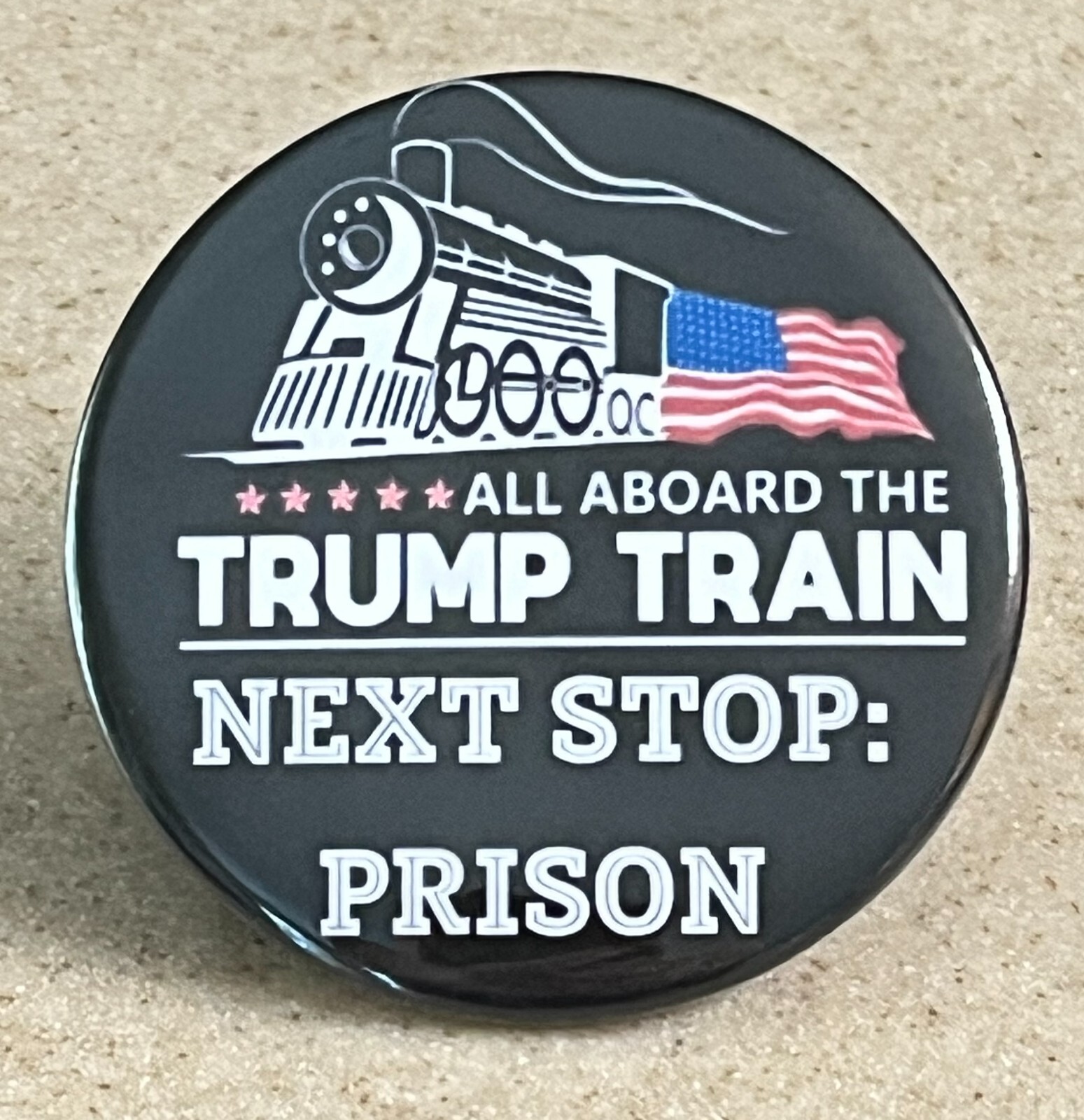 Pin-Back Button "Trump Train: Next Stop Prison" 2 1/4 inch.