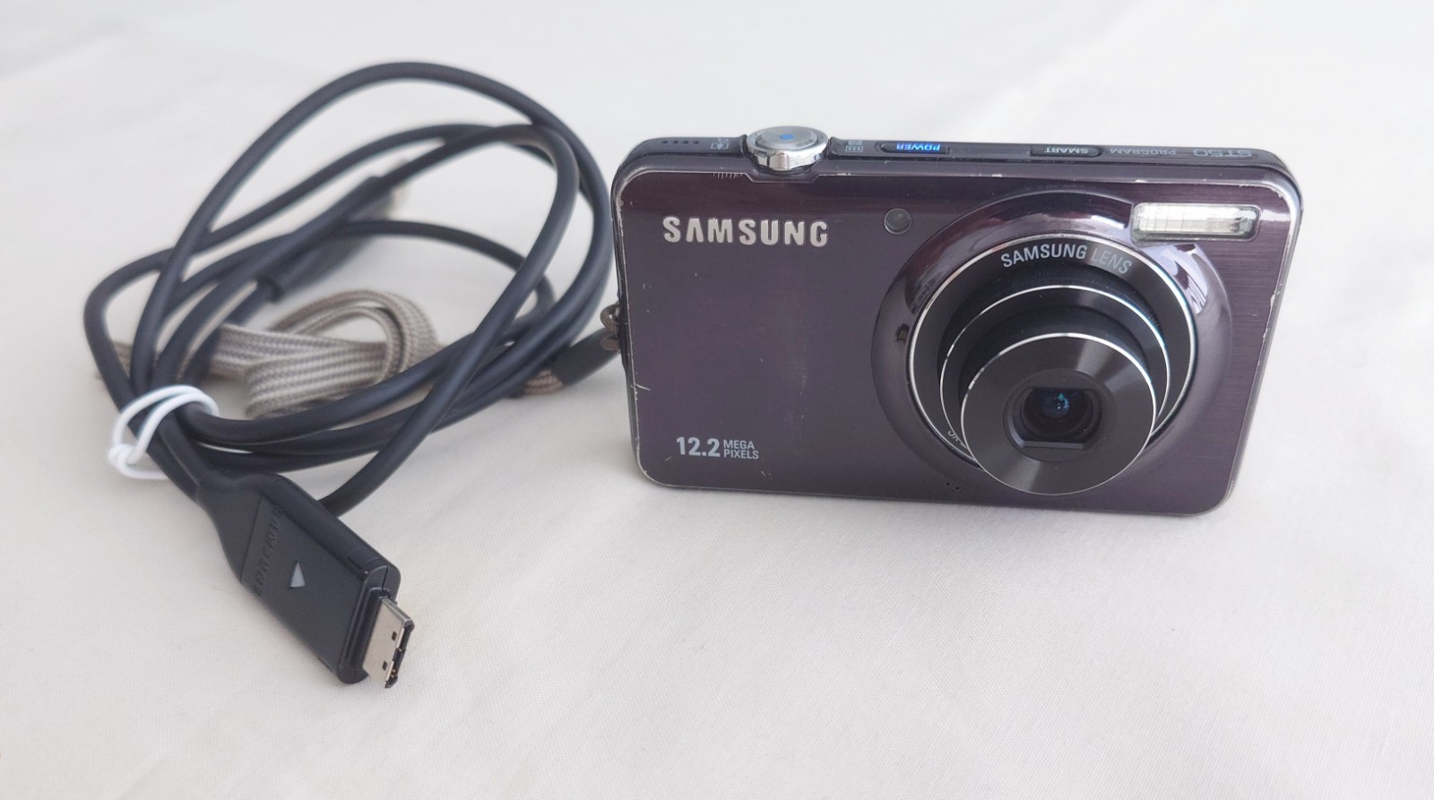 Samsung  ST50 12.2MP Digital Compact Camera, With Charging Cable - Working Order