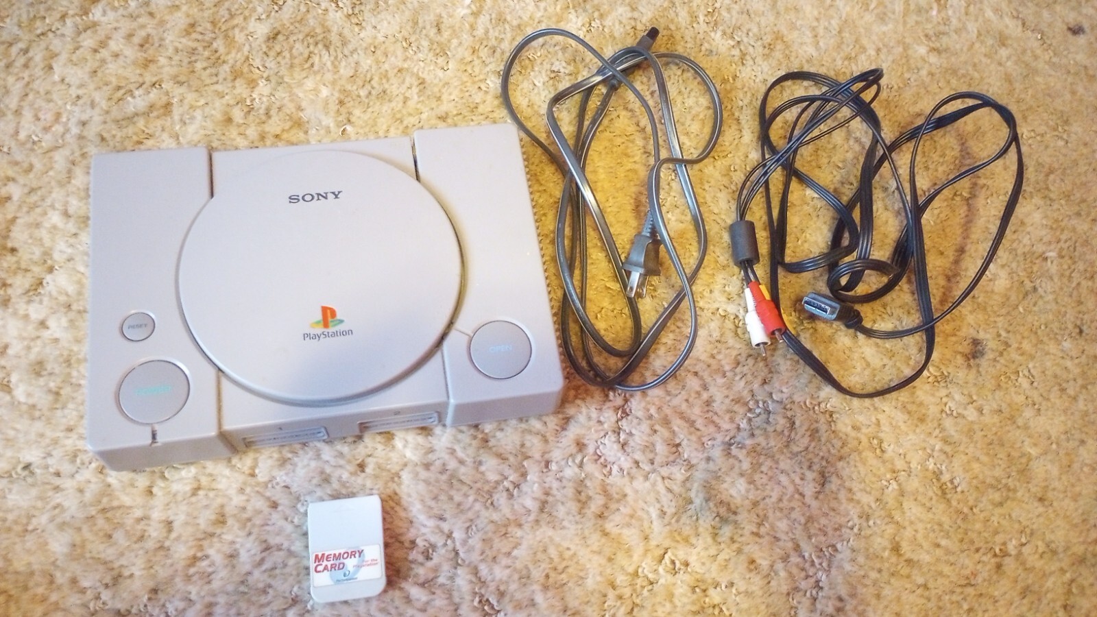 PlayStation 1 console with games
