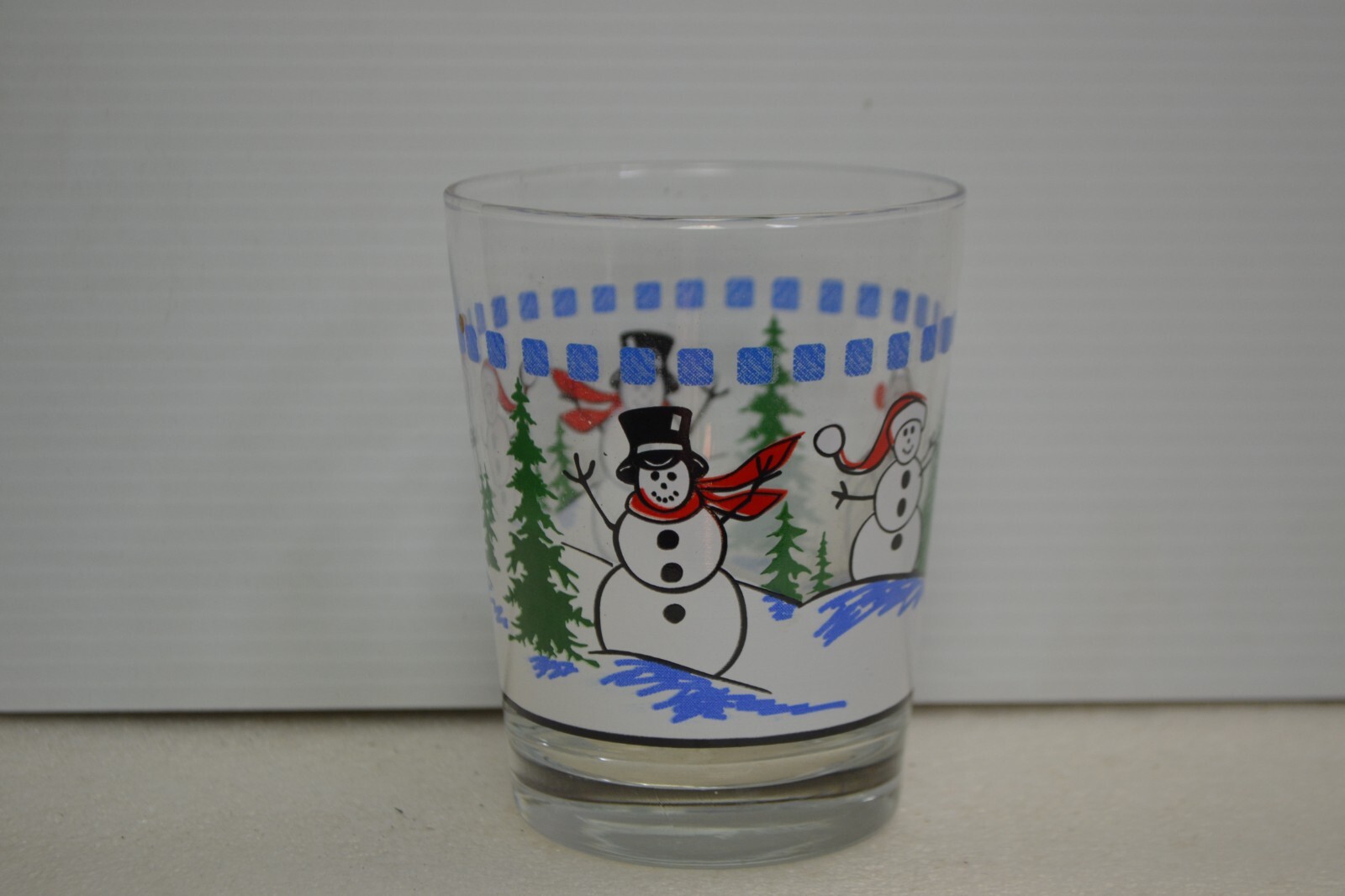 snow man drinking glass