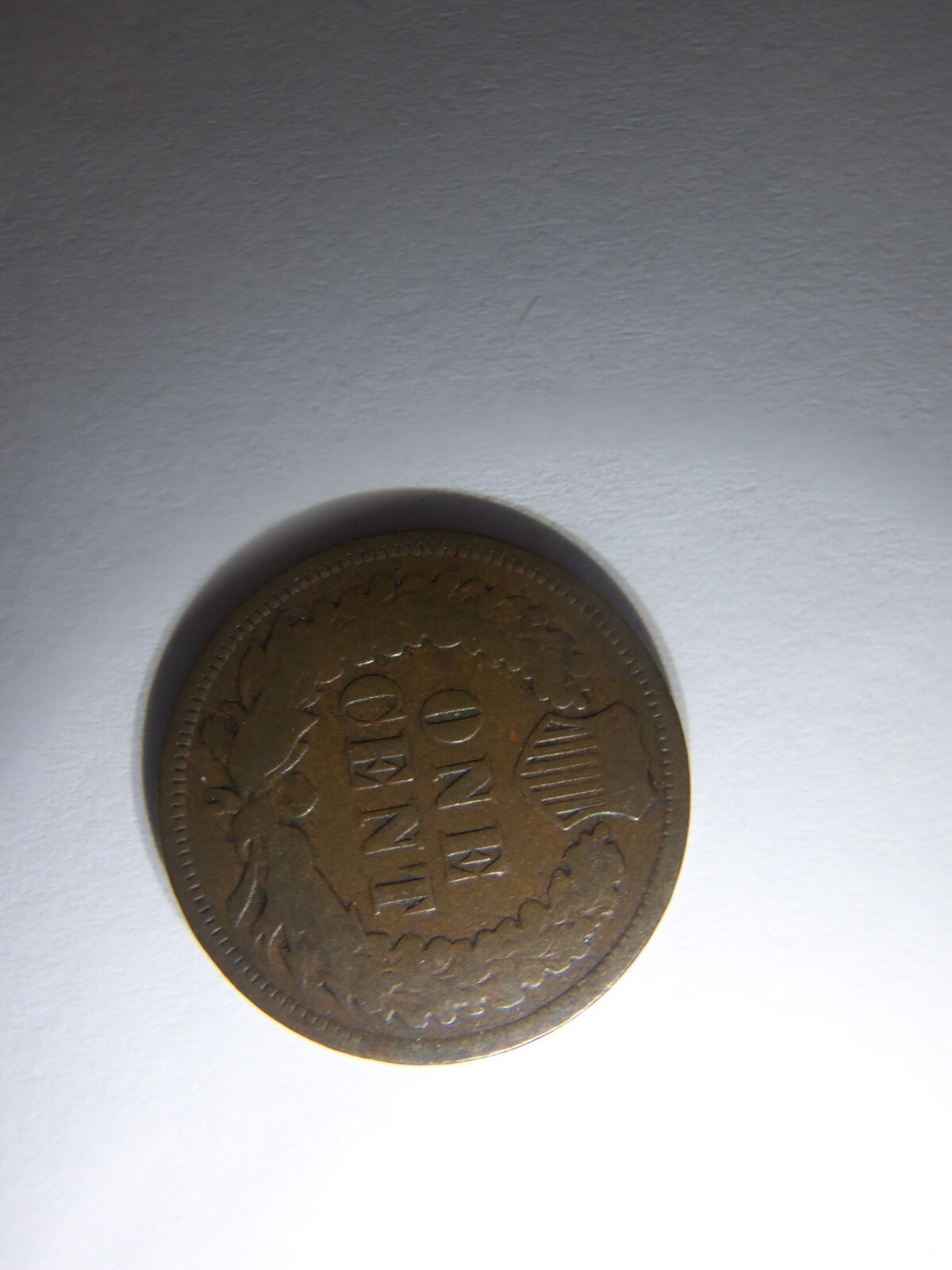A KEY 1875 INDIAN HEAD PENNY