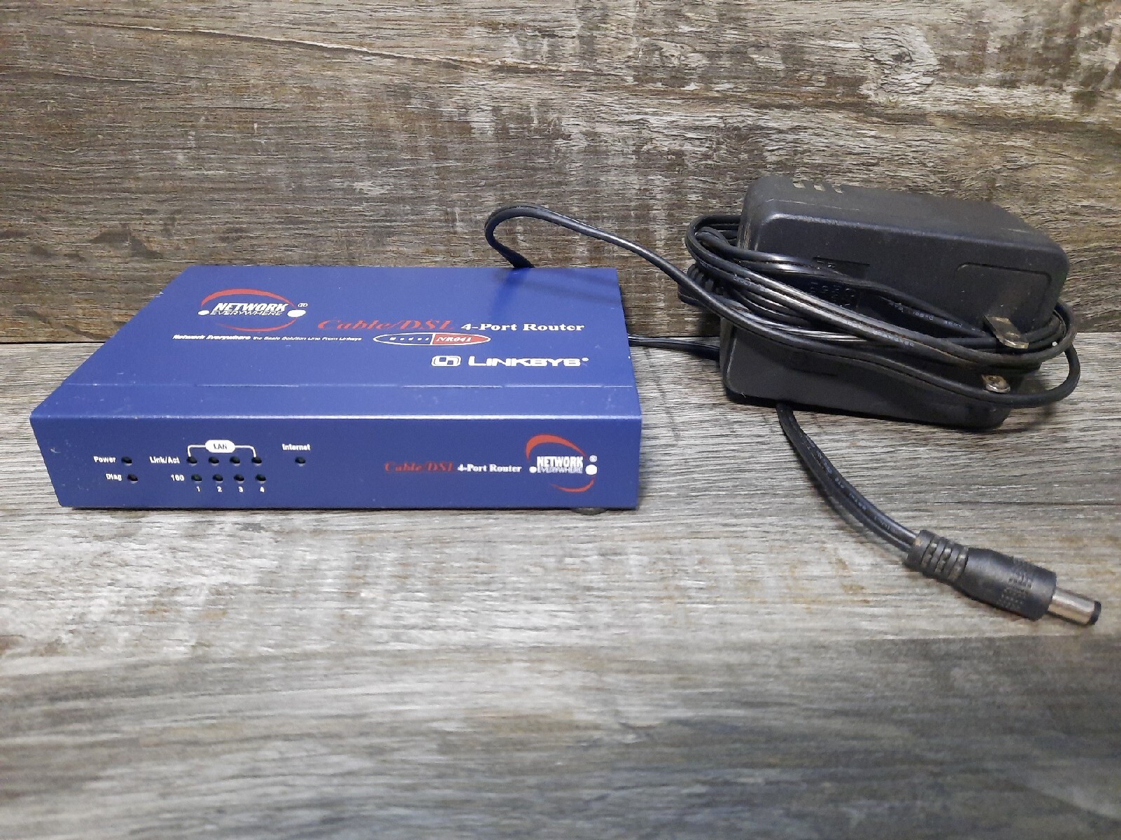 Linksys Network Everywhere NR041 Cable/DSL 4-Port Router With Charger And Cables