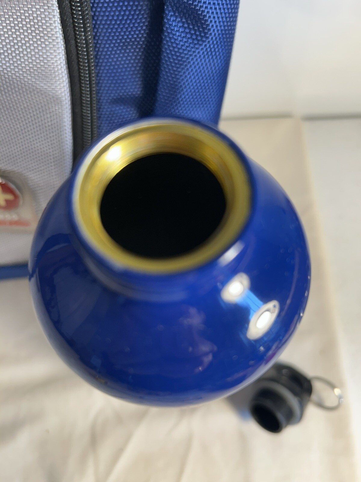 Blue/Grey NGG Swiss Edition Backpack with blue water bottle computer school