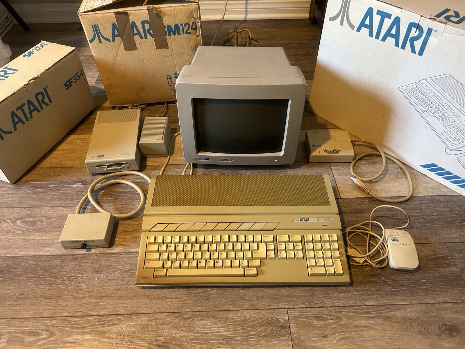 Atari 1040ST Computer w/ Monitor SM124, Disk Drive SF354, Video Key, Box, Extras