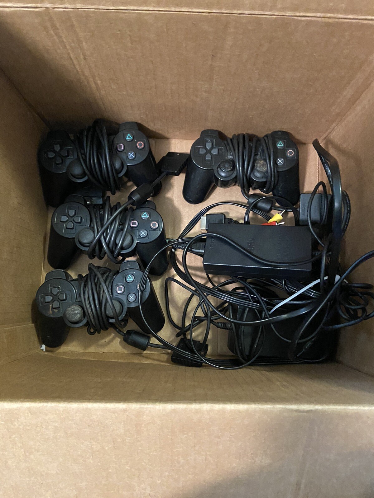 2 Ps2 Slims (one does Not Read Disc) + 4 Controllers + Memory Card+ 15 Games