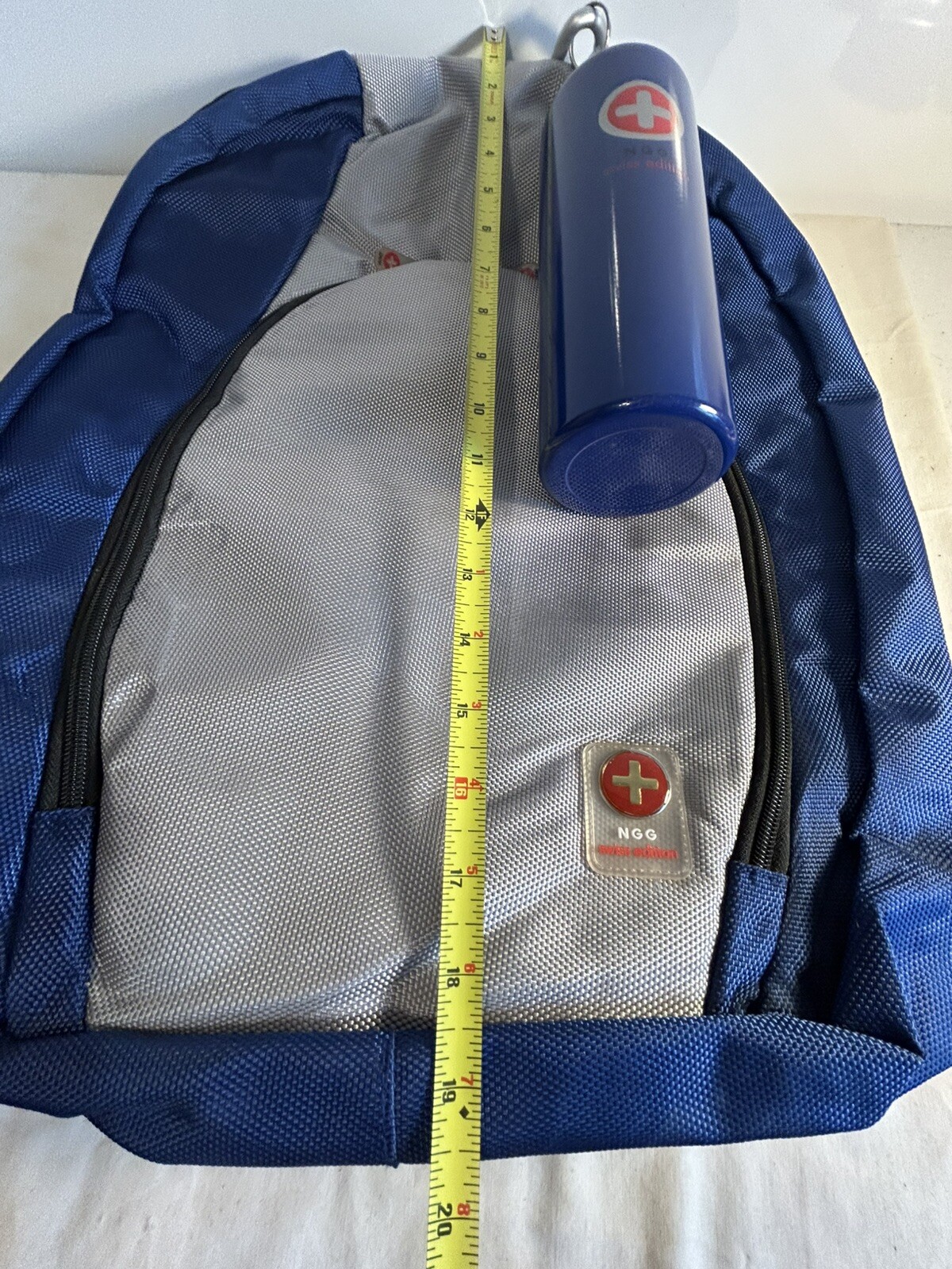 Blue/Grey NGG Swiss Edition Backpack with blue water bottle computer school