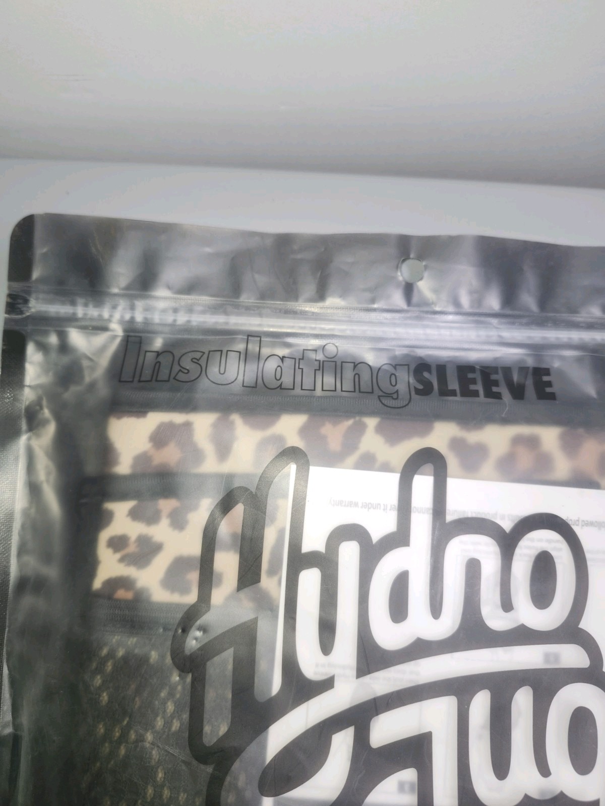 Hydrojug neoprene leopard print sleeve with strap and pocket