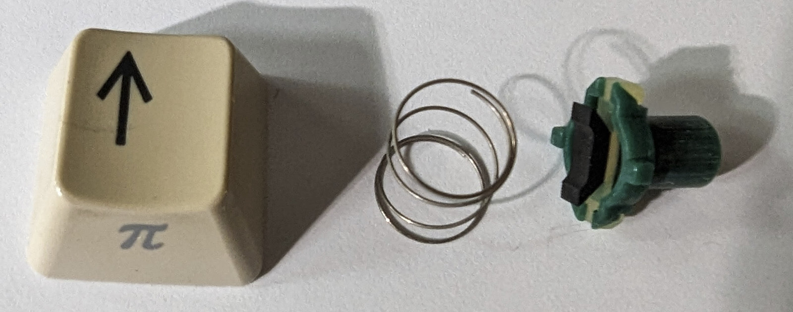 Commodore 128 (not D version)  replacement '^/UP' keycap w/plunger and spring