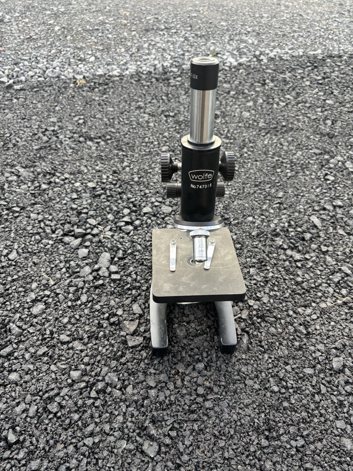 This is a vintage Wolfe student microscope likely imported from Japan,