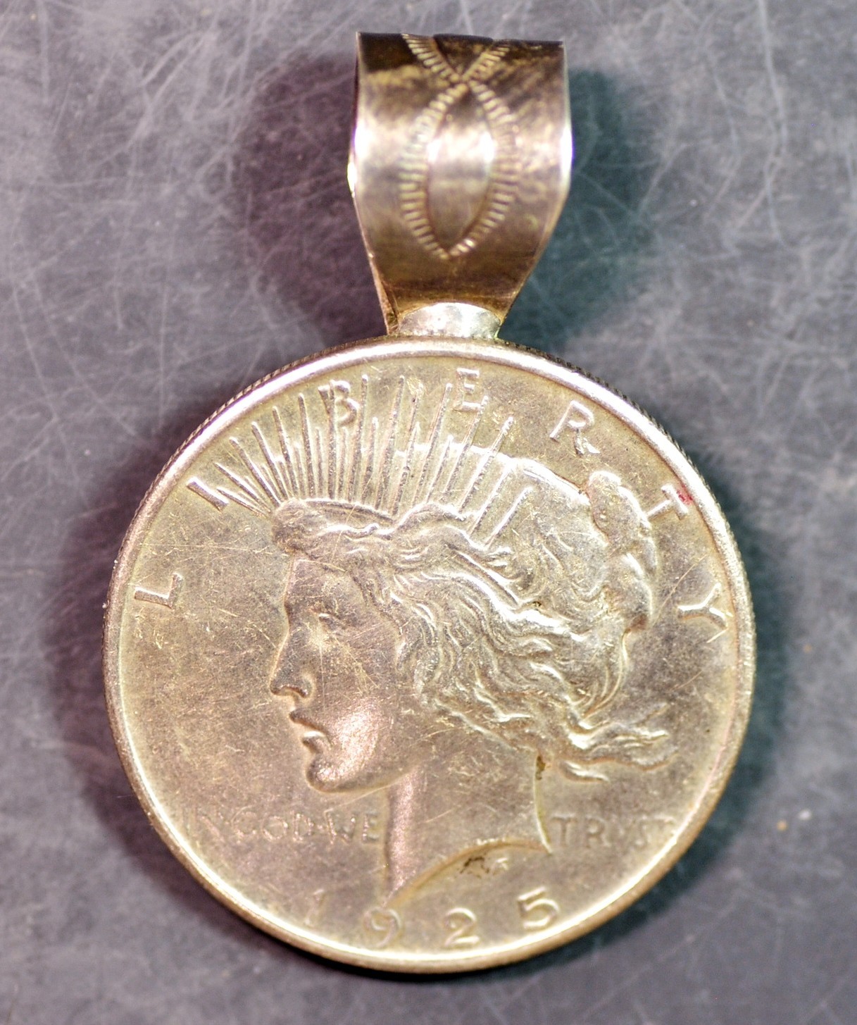 GENUINE U.S. PEACE TYPE SILVER DOLLAR! CRAFTED INTO A NICE PENDANT.