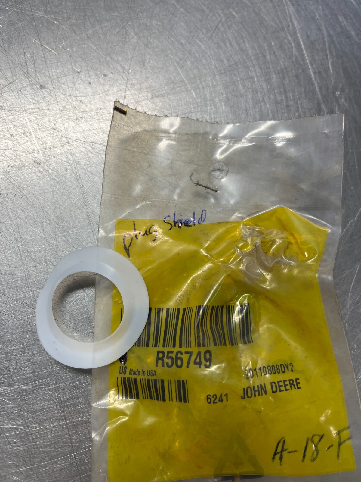 R56749   Genuine OEM  John Deere    Plug Shield